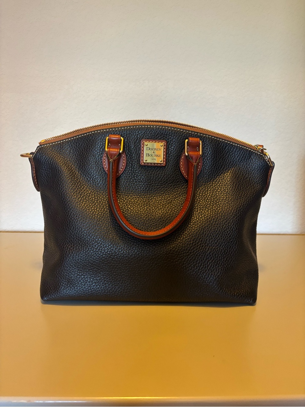 Dooney & Bourke Black Pebbled Leather Satchel with Brown Trim and Gold Hardware